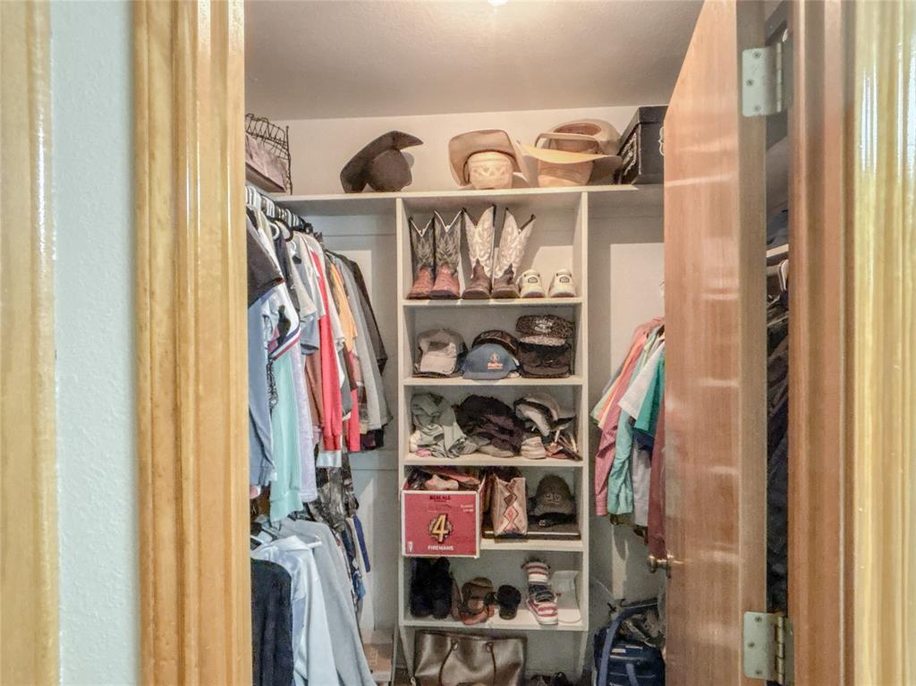7526 Fm 2114 Road Hubbard, TX 76648 - Photo 17 of 40 a view of walk in closet with clothes