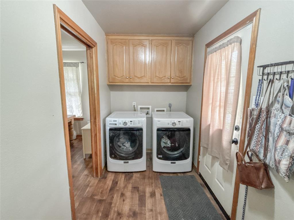 7526 Fm 2114 Road Hubbard, TX 76648 - Photo 21 of 40 a utility room with wooden floor washer and dryer