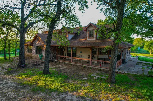 a backyard of a house with yard barbeque oven and outdoor seating