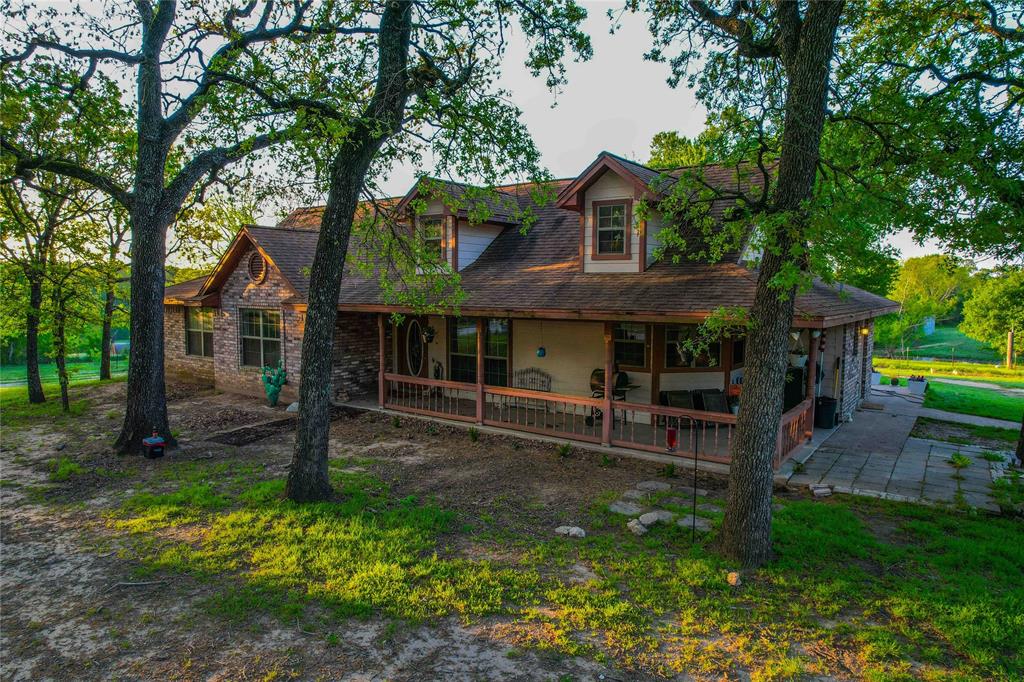 7526 Fm 2114 Road Hubbard, TX 76648 - Photo 25 of 40 a backyard of a house with yard barbeque oven and outdoor seating