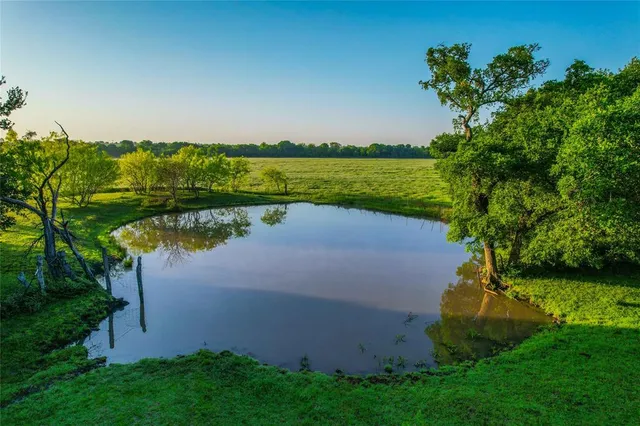 a view of a lake with a big yard