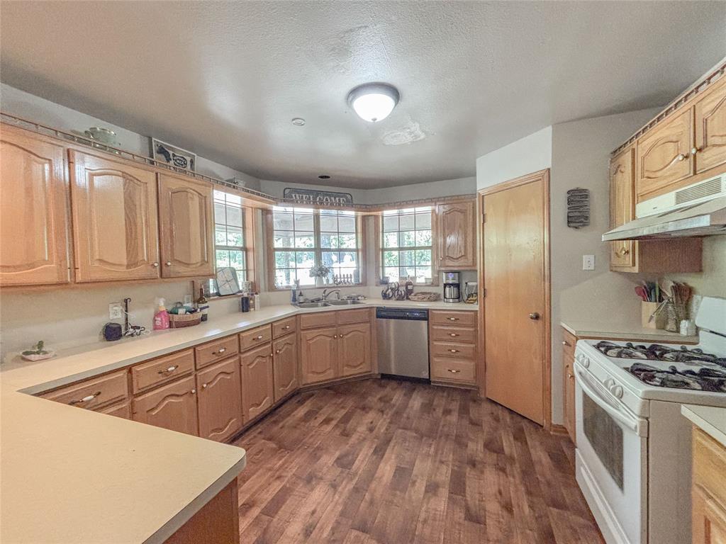 7526 Fm 2114 Road Hubbard, TX 76648 - Photo 7 of 40 a kitchen with sink a stove and refrigerator