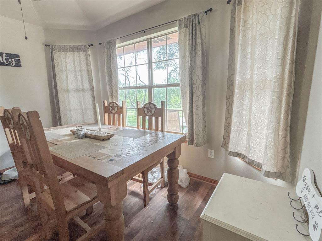 7526 Fm 2114 Road Hubbard, TX 76648 - Photo 9 of 40 a view of a dining room with furniture window and wooden floor