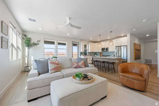 762 West Periwinkle Lane, Unit 102 St. George, UT 84790 - Photo 1 of 40 Living area featuring light wood-style floors, a ceiling fan, and recessed lighting