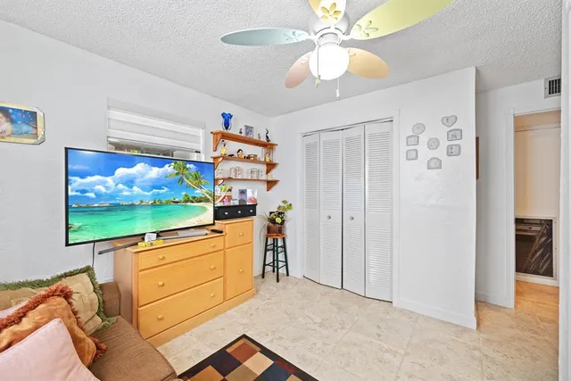 a living room with fireplace furniture and a flat screen tv