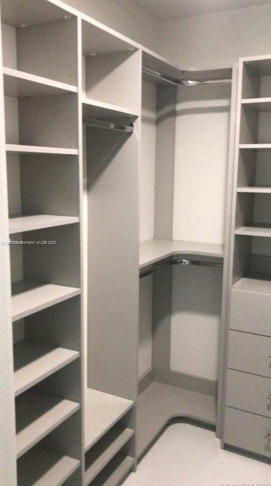 851 Northeast 1st Avenue, Unit 903 Miami, FL 33132 - Photo 13 of 34 a view of an empty walk in closet
