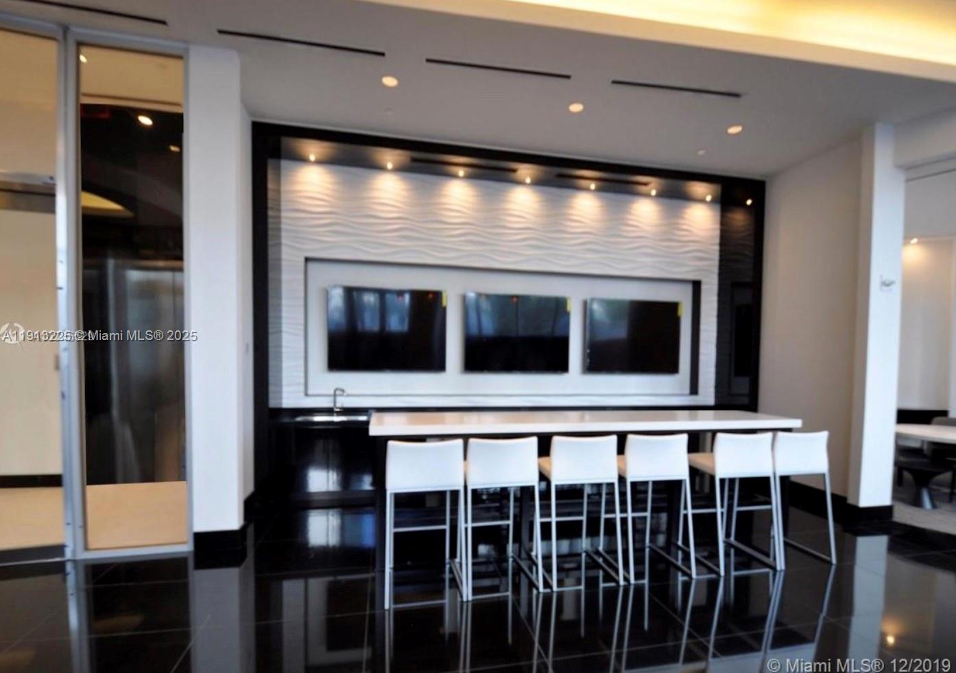 851 Northeast 1st Avenue, Unit 903 Miami, FL 33132 - Photo 27 of 34 a view of a large room with a large window