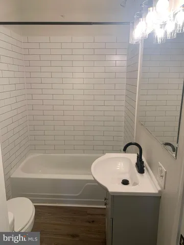 a bathroom with a sink and a shower