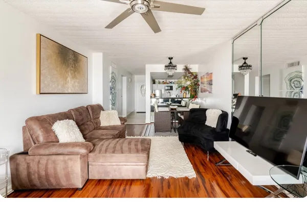 a living room with furniture and a rug