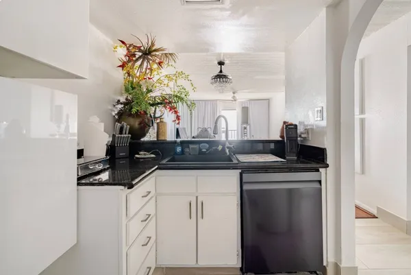 a kitchen with a sink and cabinets