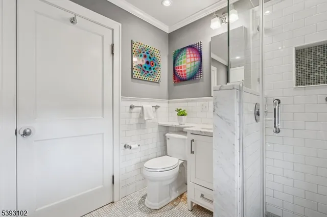 a bathroom with a toilet a sink and a shower