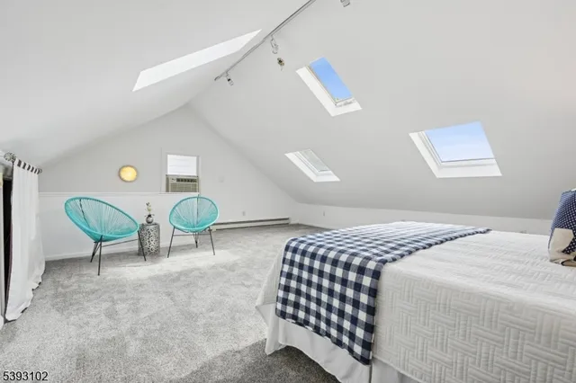 a bedroom with a bed and a chair