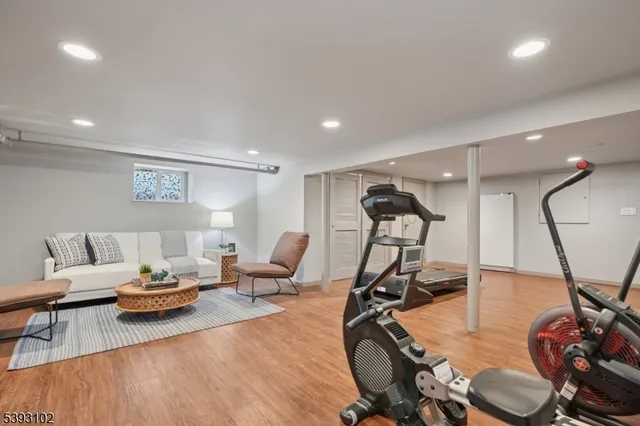 a living room with furniture gym equipment and a view of living room