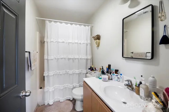 a bedroom with bed and a couch