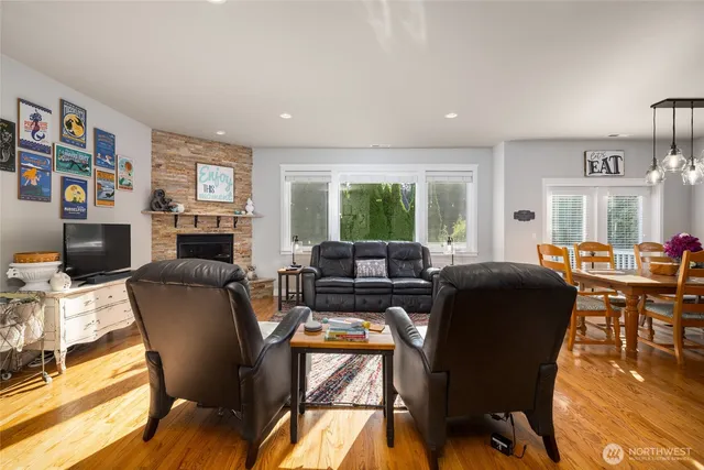 a living room with fireplace furniture and a flat screen tv