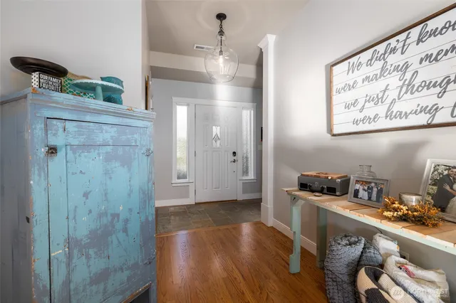 a kitchen with a refrigerator and cabinets