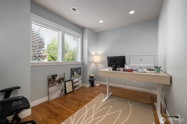 a room with a bed and a table in it