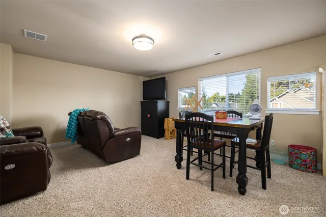 a dining room with furniture and window