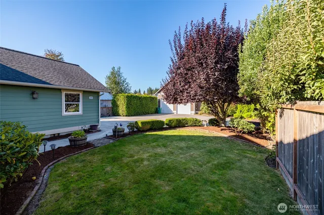 a view of a house with a backyard porch and sitting area
