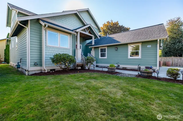 a front view of house with yard and outdoor seating