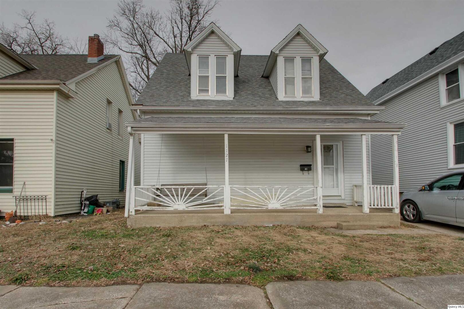 1127 Payson Avenue Quincy, IL 62301 - Photo 1 of 16 a front view of a house with garden