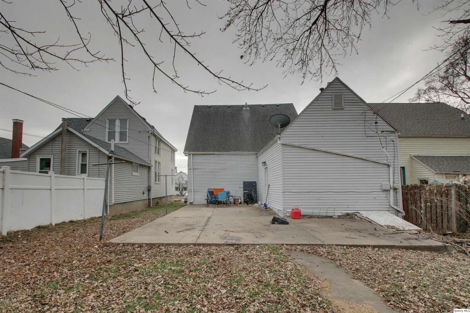1127 Payson Avenue Quincy, IL 62301 - Photo 3 of 16 a view of a house with a snow on the road
