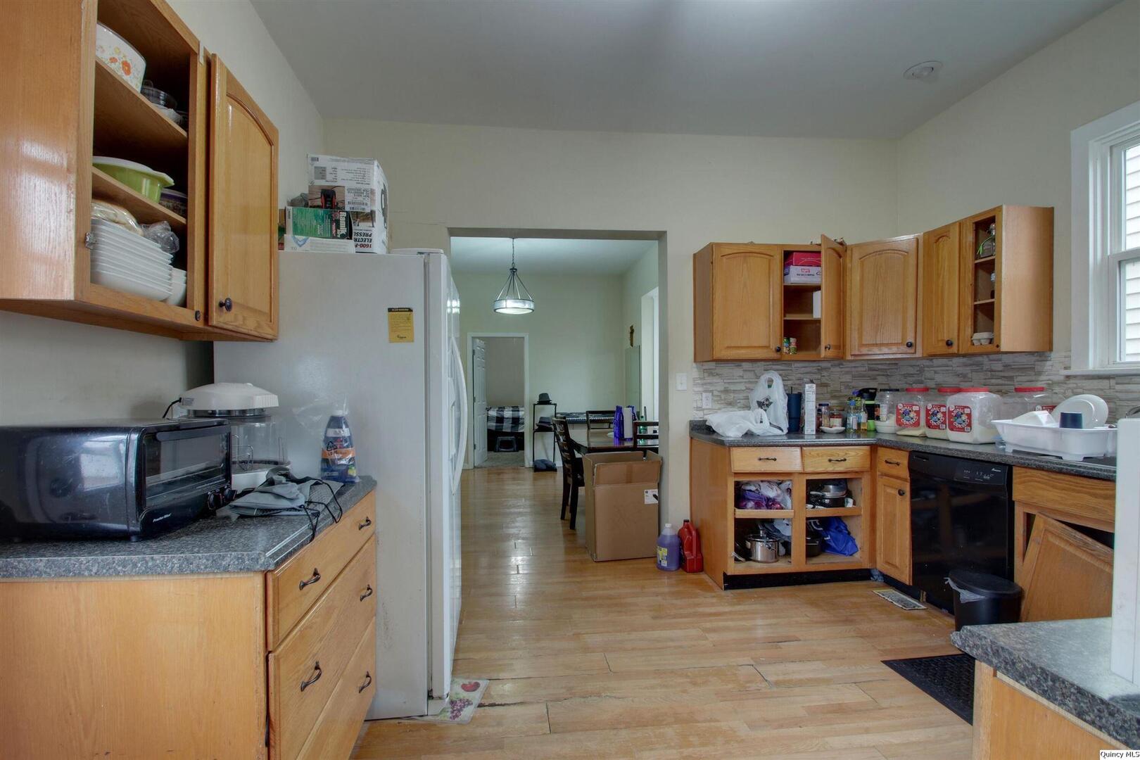 1127 Payson Avenue Quincy, IL 62301 - Photo 8 of 16 a view of a kitchen with furniture and a kitchen