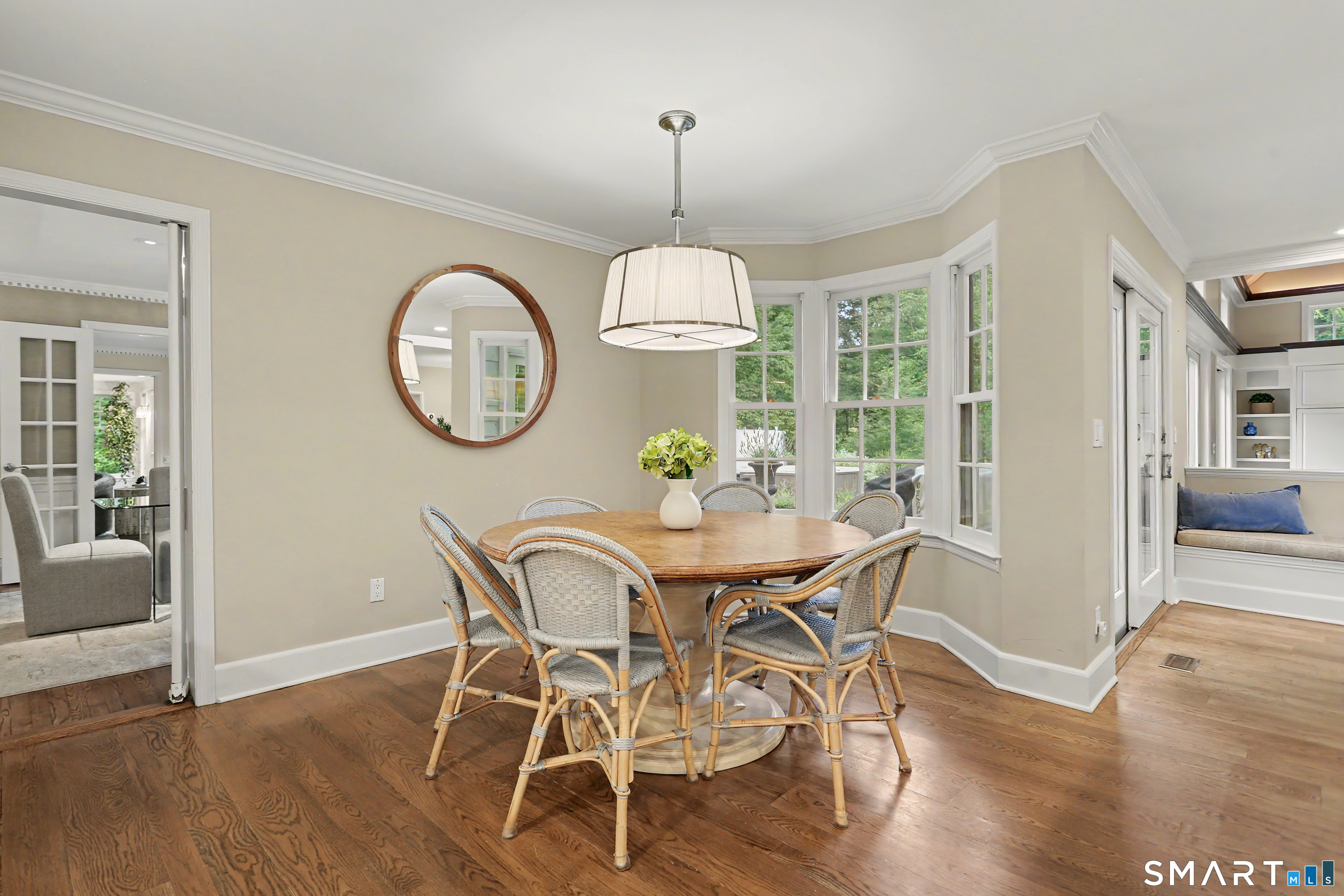 108 Logan Road New Canaan, CT 06840 - Photo 10 of 40 a view of a dining room with furniture window and wooden floor