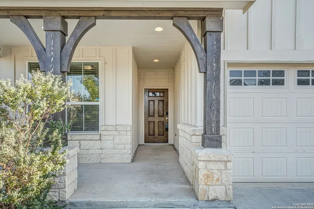 a front view of a house with a glass door