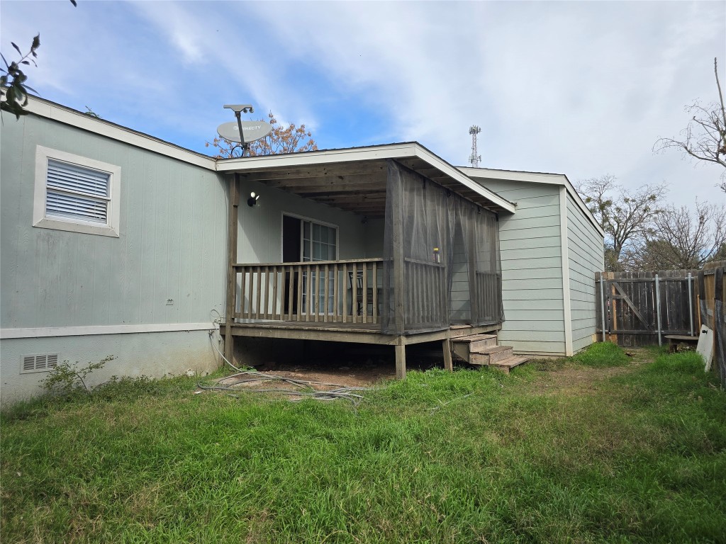 7628 Northview Lane Austin, TX 78724 - Photo 15 of 19 Rear view of property featuring crawl space and a deck