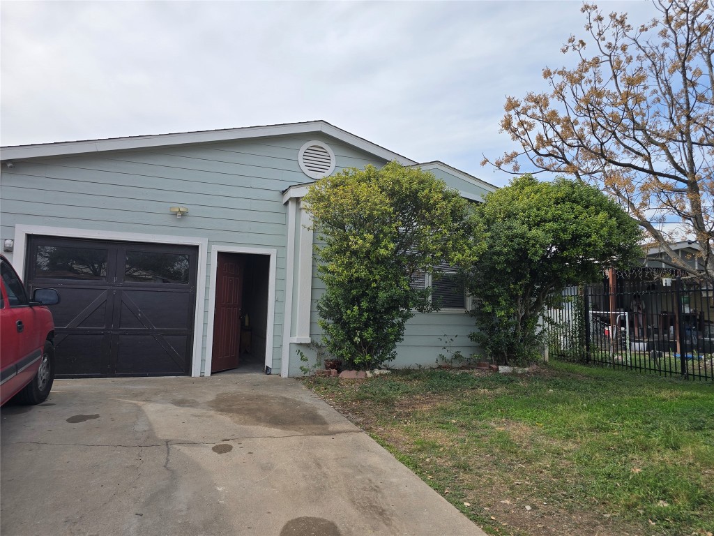 7628 Northview Lane Austin, TX 78724 - Photo 16 of 19 View of front of home featuring concrete driveway and a garage