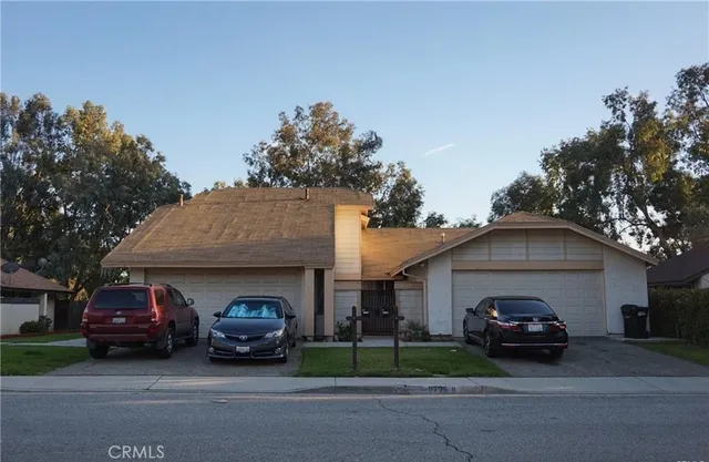 a car parked in front of a house