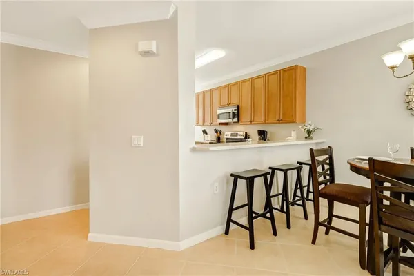 a kitchen with a table and chairs in it