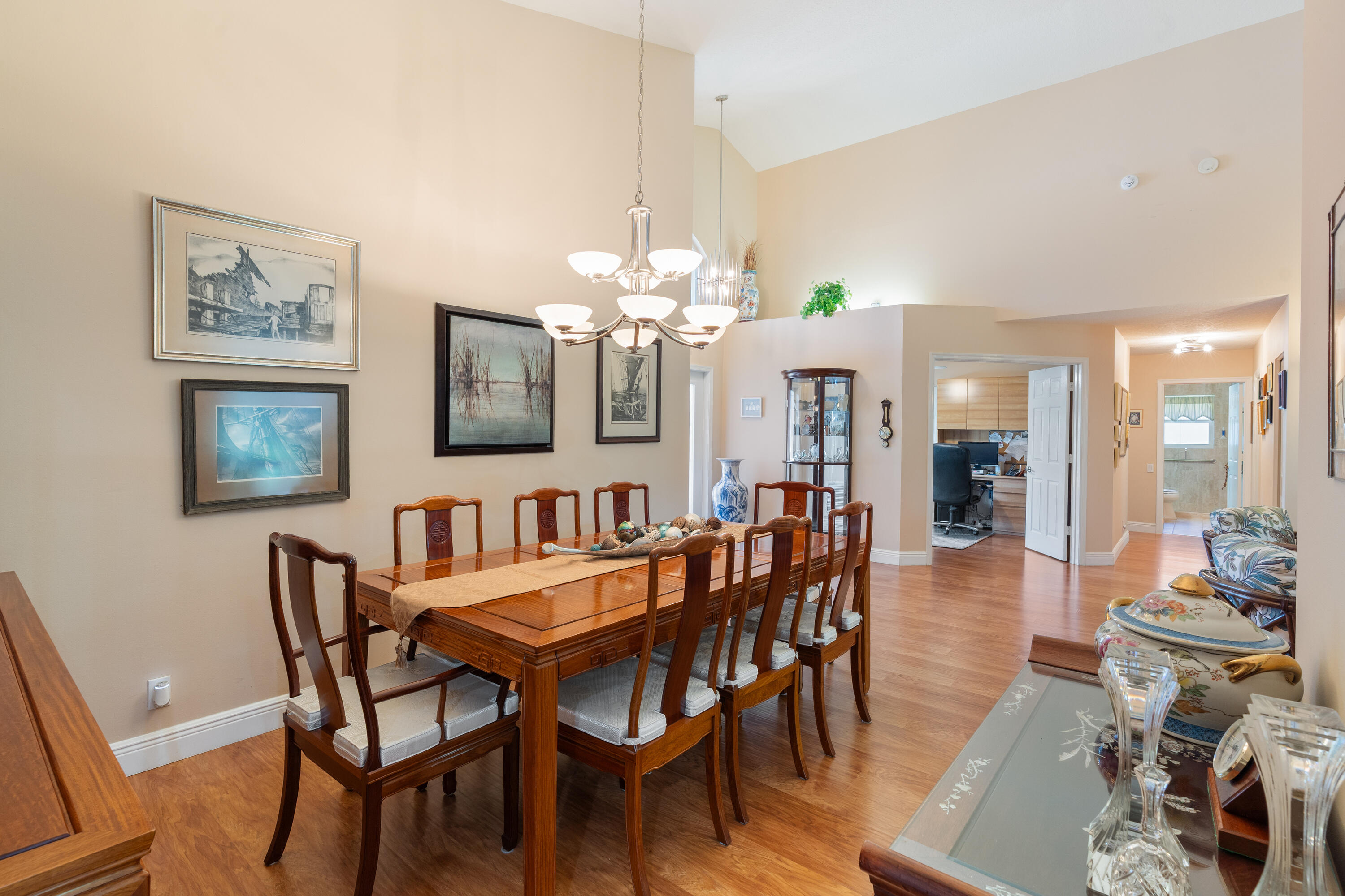 7296 Falls Road East Boynton Beach, FL 33437 - Photo 11 of 25 a view of a dining room with furniture and chandelier