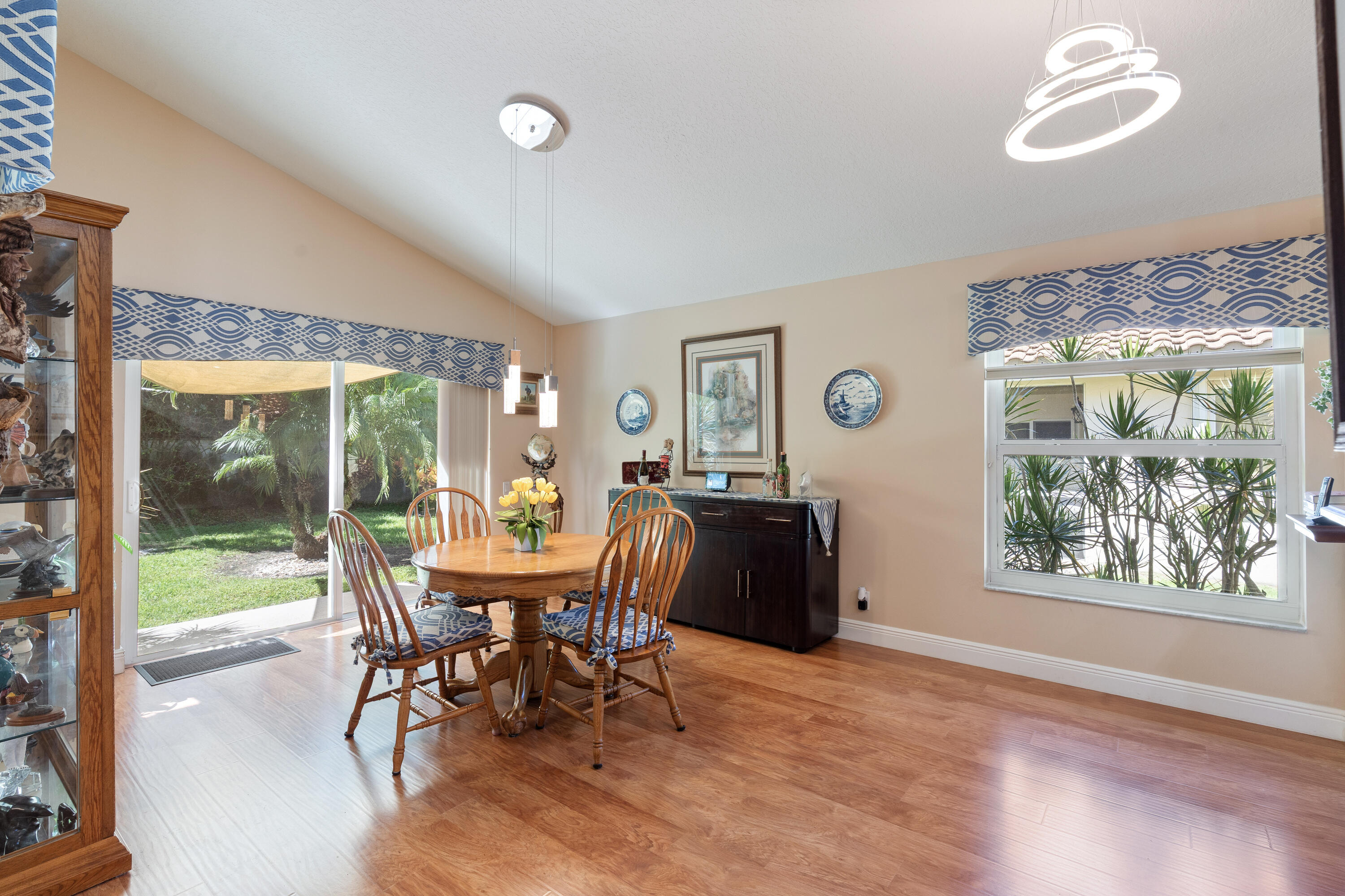 7296 Falls Road East Boynton Beach, FL 33437 - Photo 12 of 25 a view of a dining room with furniture window and wooden floor
