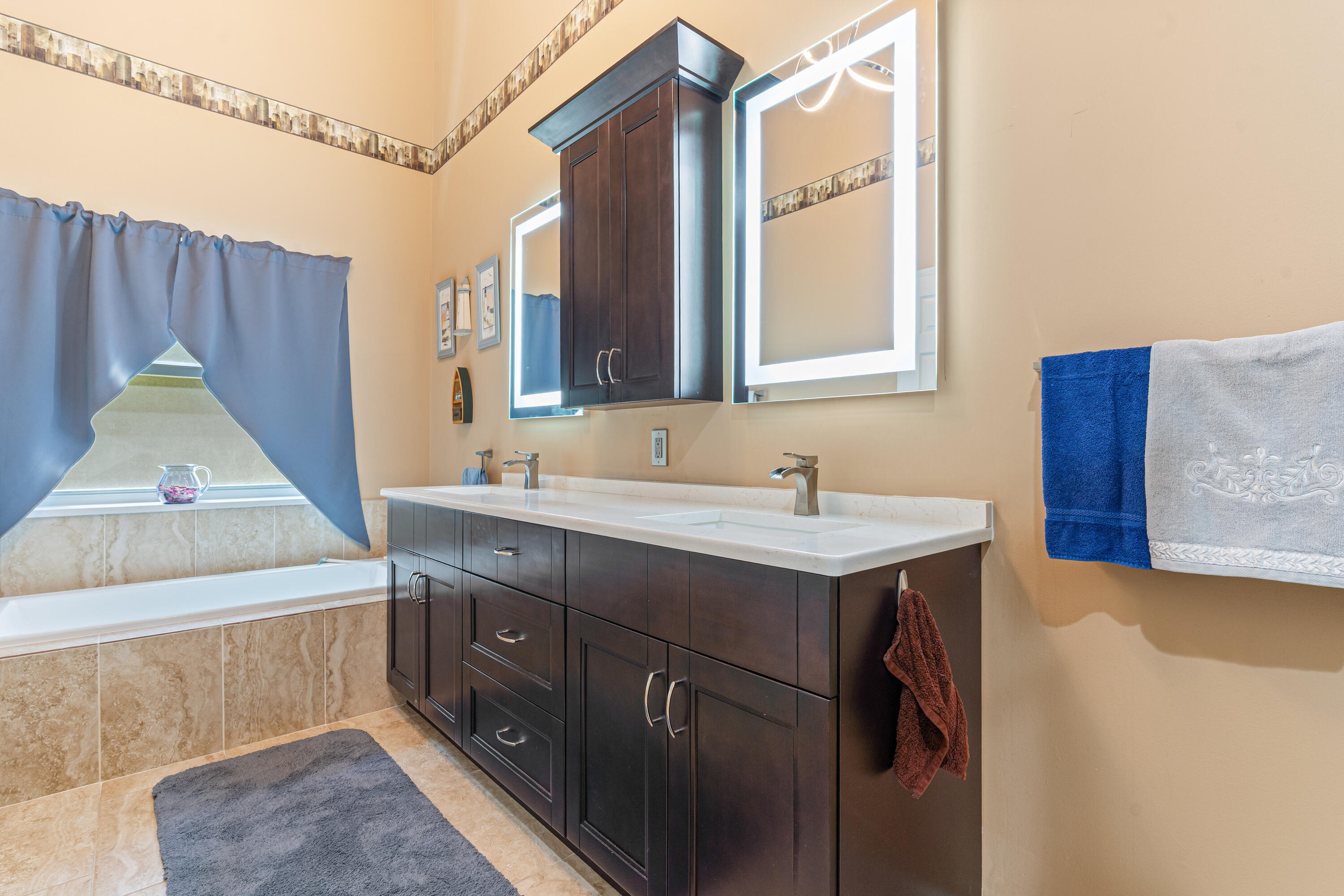 7296 Falls Road East Boynton Beach, FL 33437 - Photo 17 of 25 a bathroom with a sink and a mirror