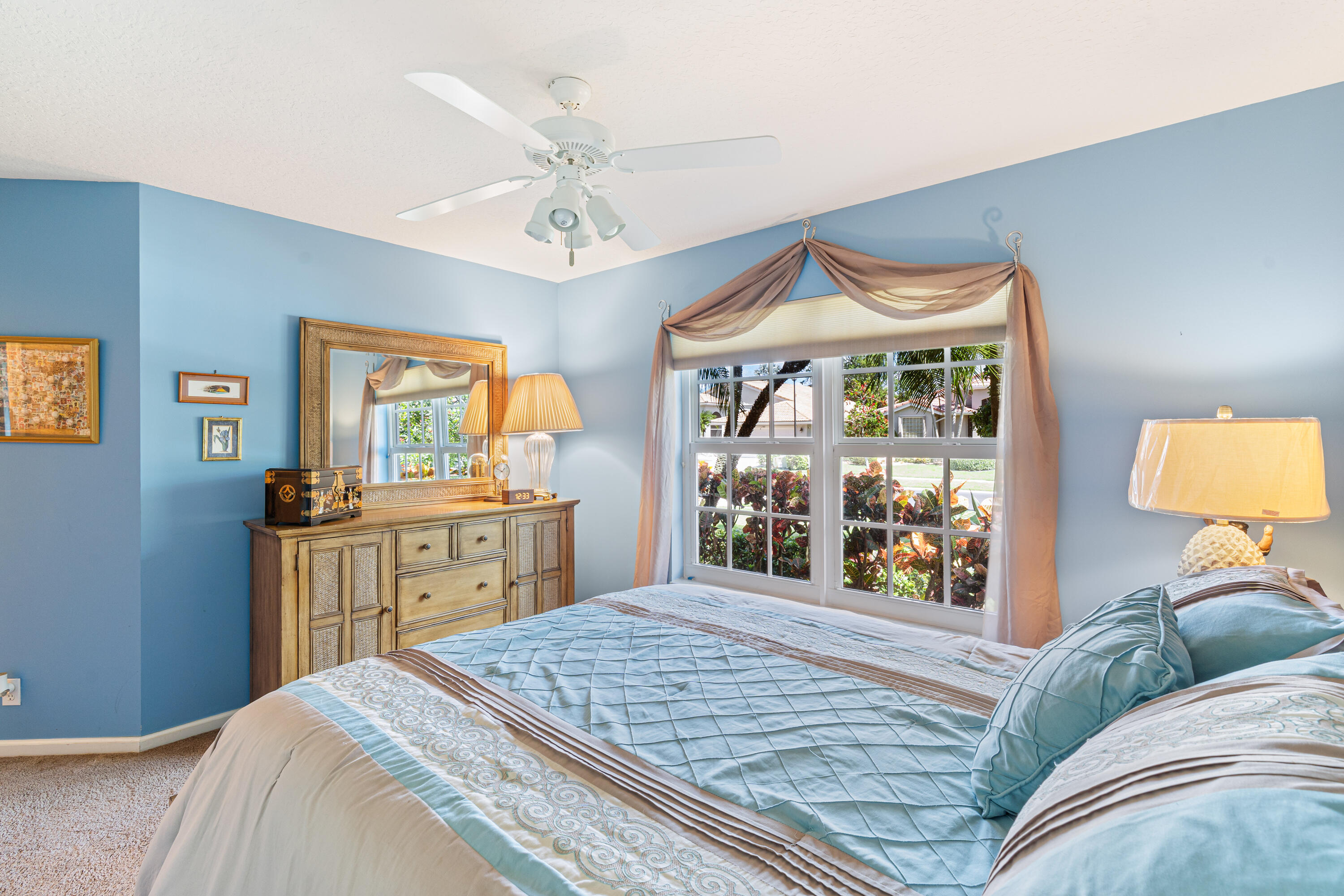 7296 Falls Road East Boynton Beach, FL 33437 - Photo 19 of 25 a bedroom with a large bed and a window