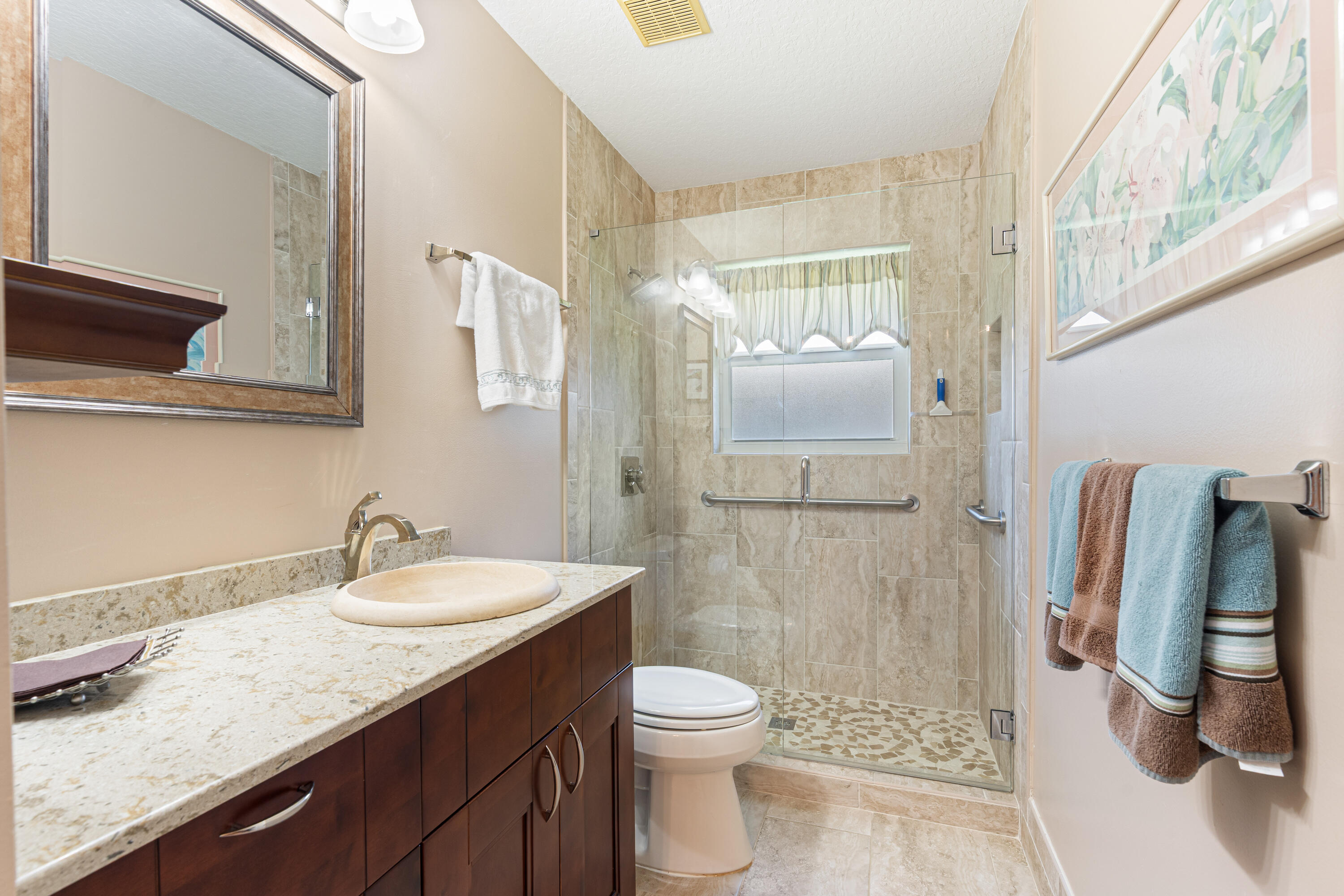 7296 Falls Road East Boynton Beach, FL 33437 - Photo 20 of 25 a bathroom with a granite countertop sink a toilet and shower