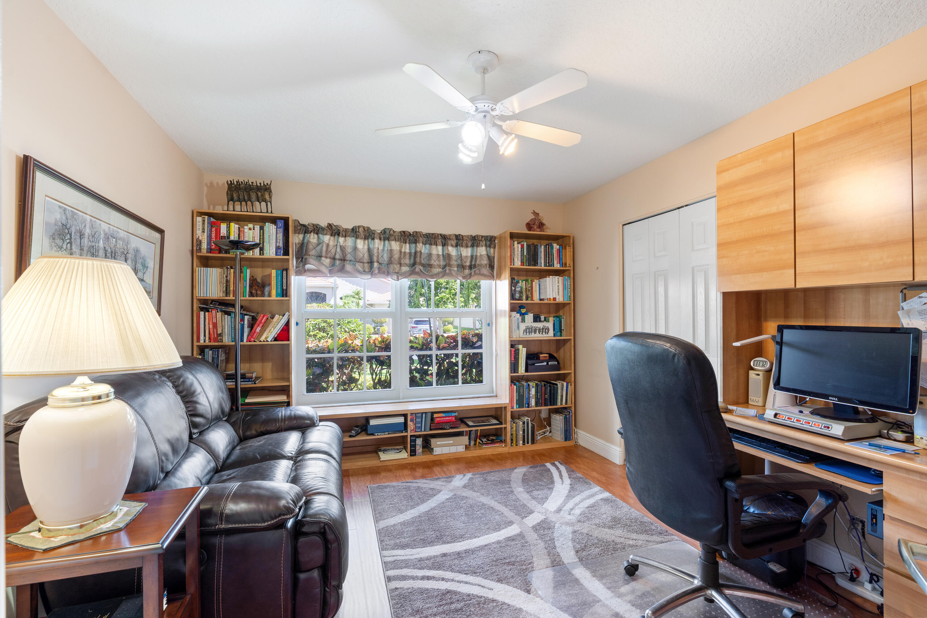 7296 Falls Road East Boynton Beach, FL 33437 - Photo 21 of 25 a living room with furniture and a flat screen tv