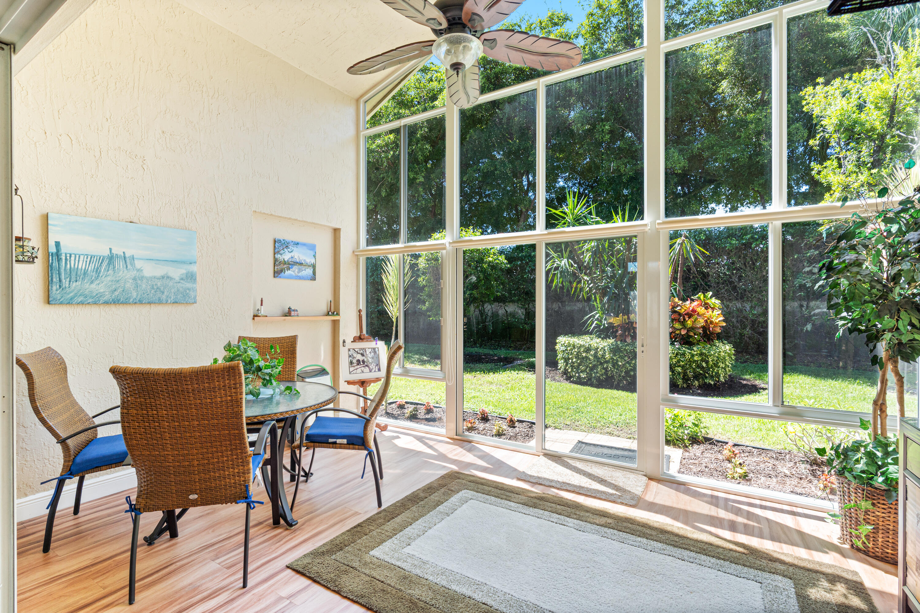 7296 Falls Road East Boynton Beach, FL 33437 - Photo 23 of 25 a view of a living room and a floor to ceiling window and wooden floor