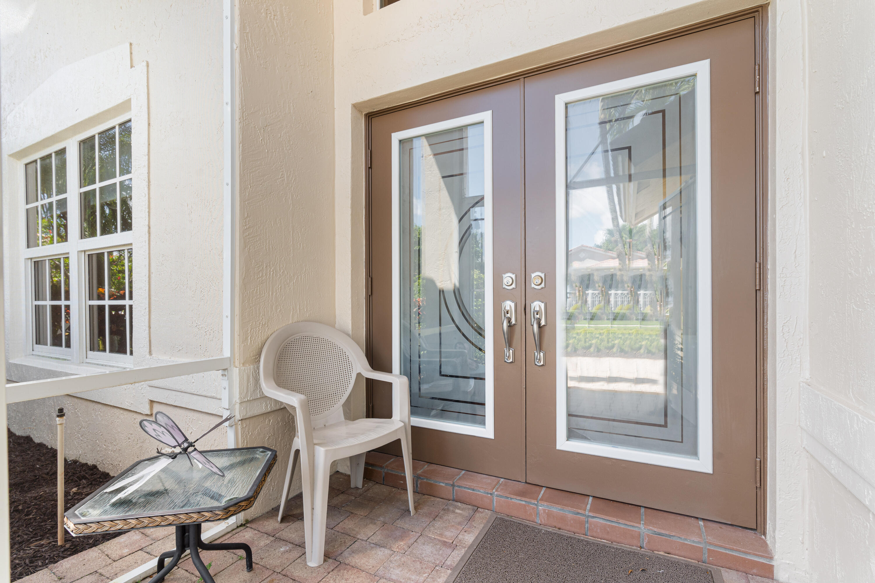 7296 Falls Road East Boynton Beach, FL 33437 - Photo 3 of 25 a view of a room that has a window and furniture