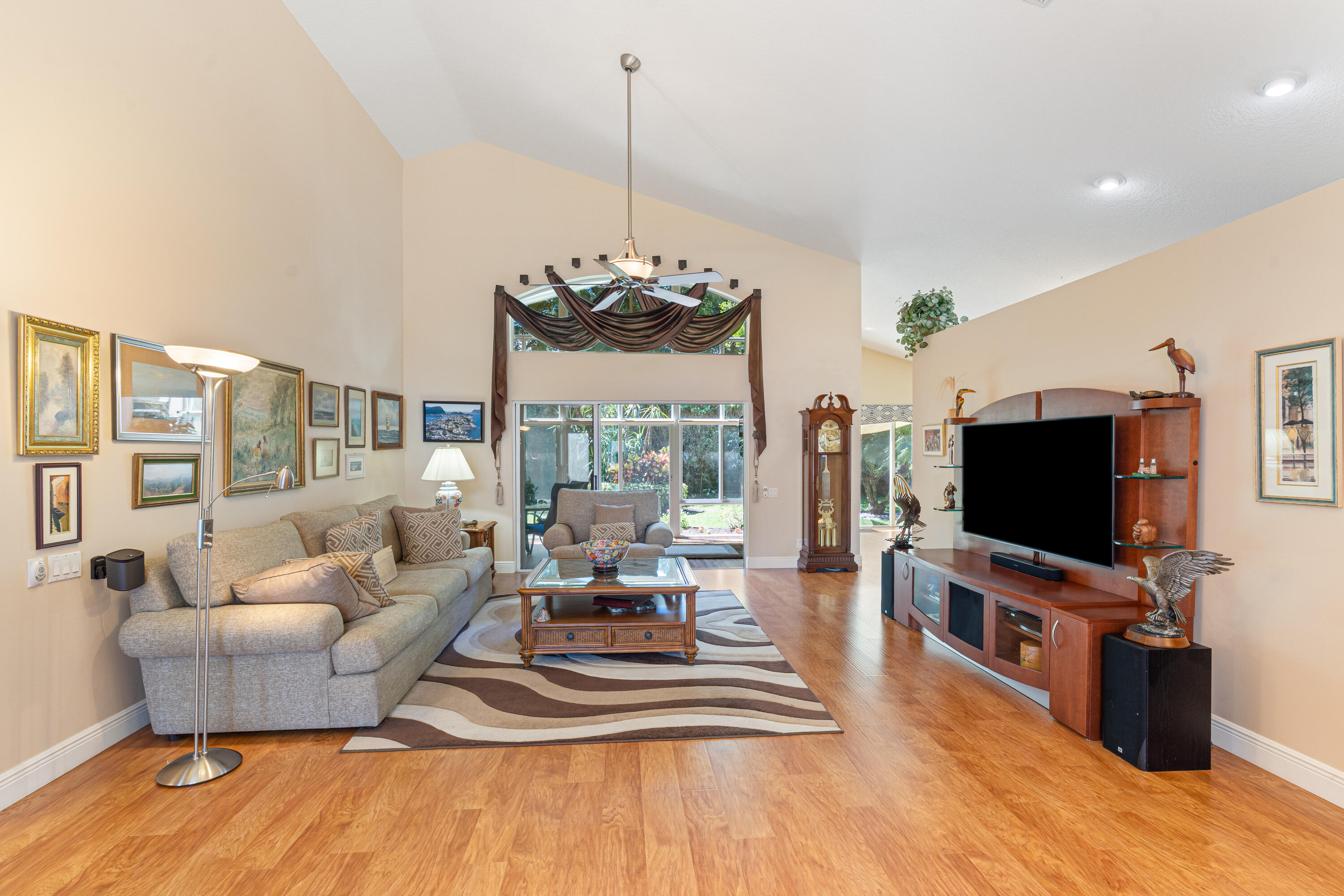 7296 Falls Road East Boynton Beach, FL 33437 - Photo 4 of 25 a living room with furniture and a flat screen tv