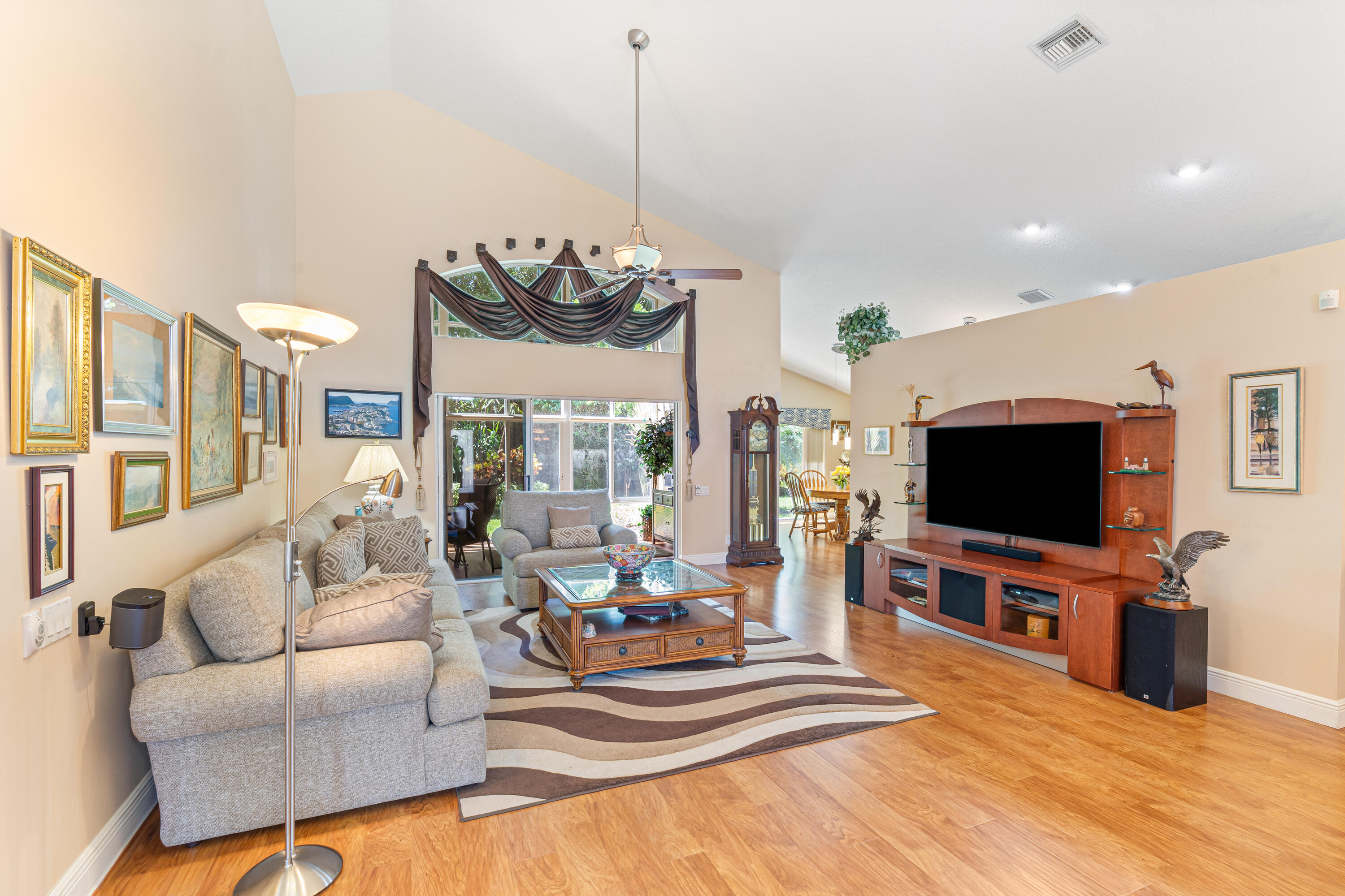 7296 Falls Road East Boynton Beach, FL 33437 - Photo 5 of 25 a living room with furniture and a flat screen tv