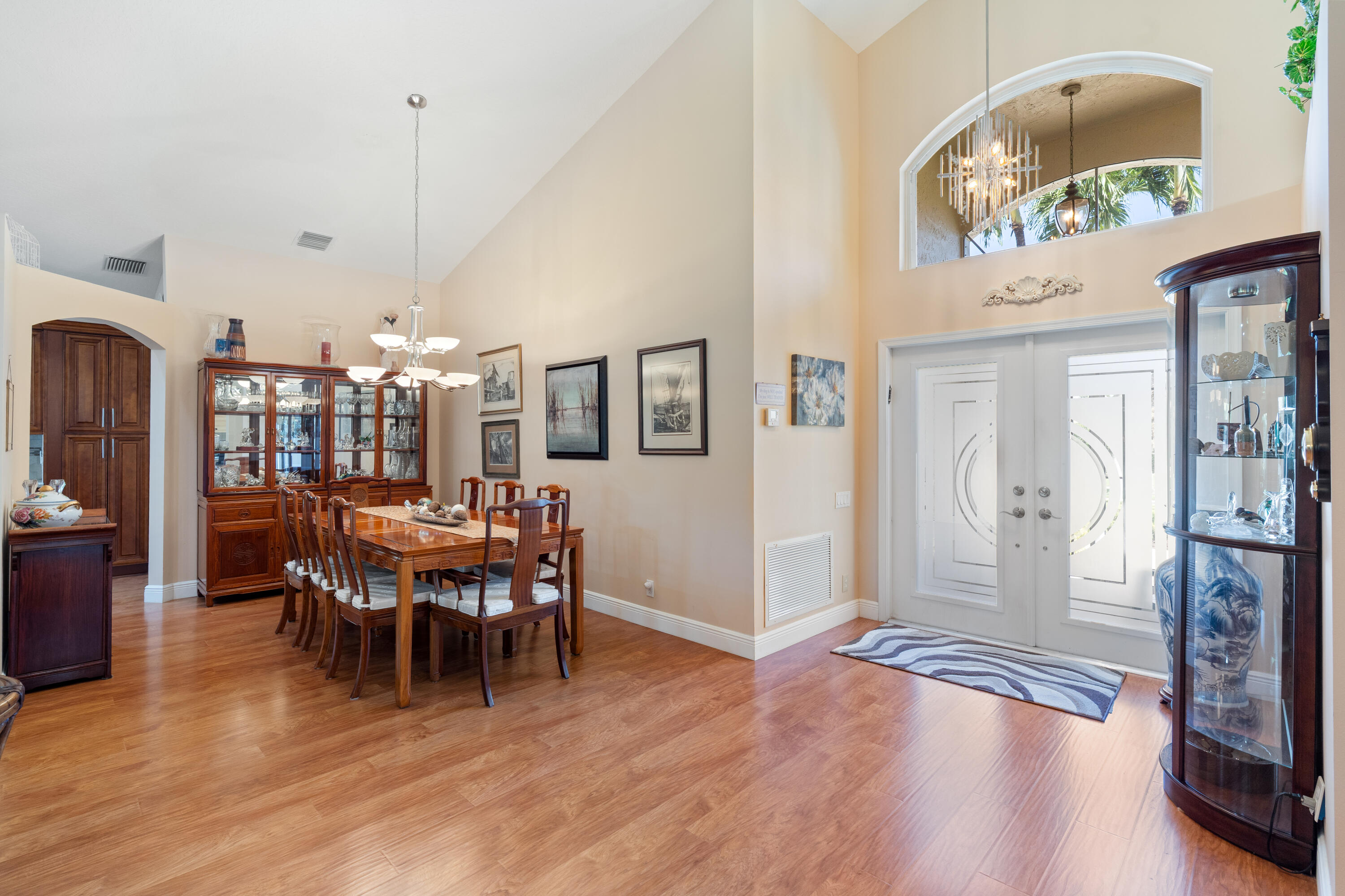 7296 Falls Road East Boynton Beach, FL 33437 - Photo 10 of 25 a view of a dining room with furniture and wooden floor