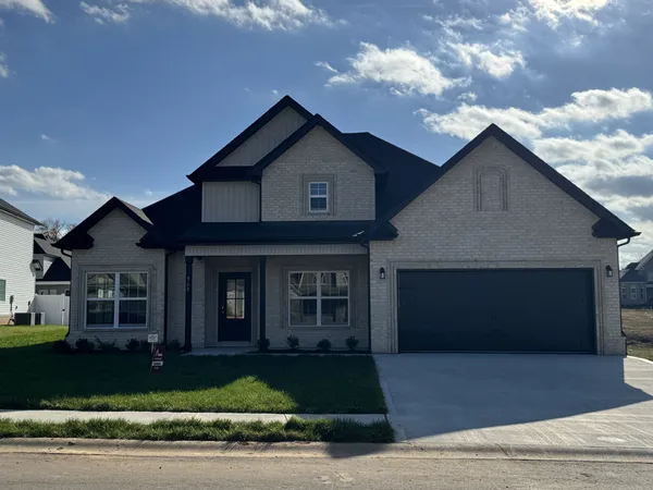 a front view of a house with garage
