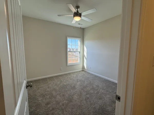 an empty room that has a window in it