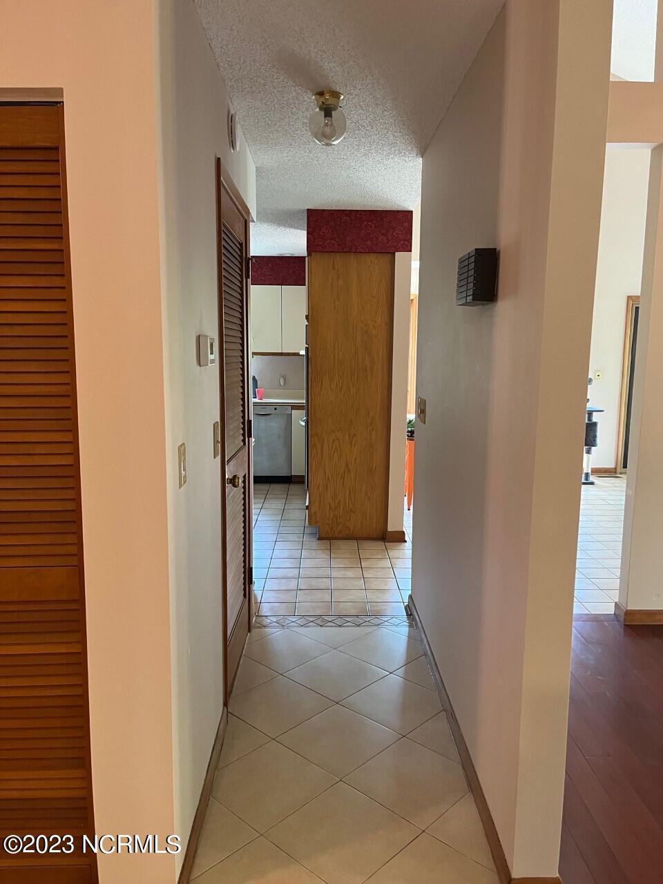 402 Ravenswood Road Hampstead, NC 28443 - Photo 27 of 130 Foyer to Kitchen