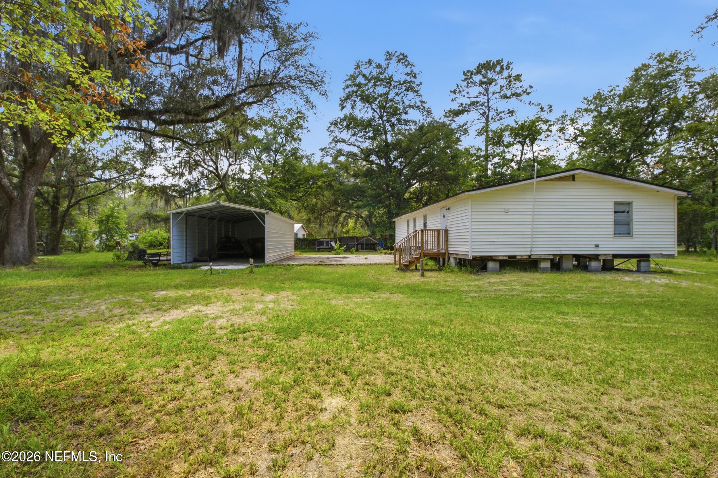 5667 Long Branch Cemetery Road Jacksonville, FL 32234 - Photo 21 of 24 a house view with garden space