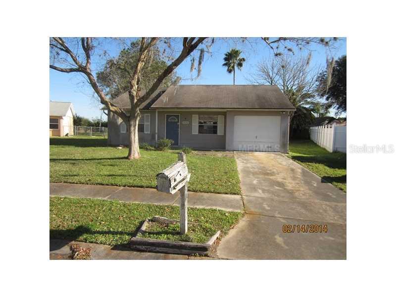 7926 Knox Loop New Port Richey, FL 34655 - Photo 1 of 1 a front view of a house with garden