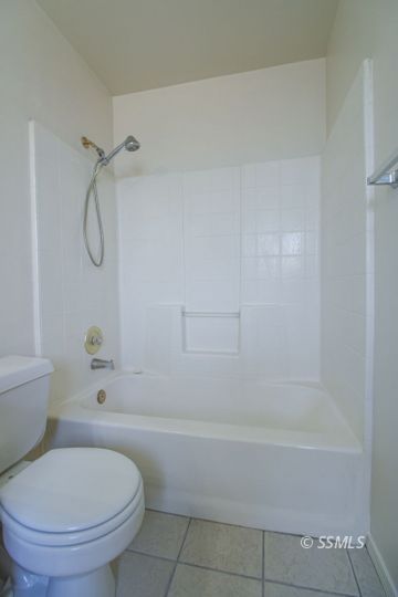 649 Regency Court Ridgecrest, CA 93555 - Photo 24 of 31 a bathroom with a toilet and a shower